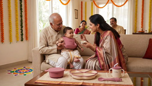 Indian family at Annaprashan ceremony with Cubkins silicone feeding set arranged beside the baby