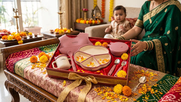 Cubkins 7-piece silicone feeding set arranged as an Annaprashan gift with a silver spoon