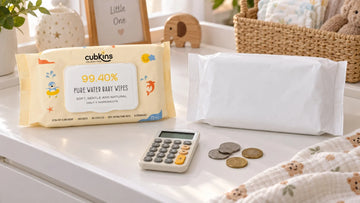 Cubkins Pure Water Baby Wipes pack beside a regular wipes pack and a calculator on an Indian changing table