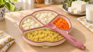 Soft home-made paneer cubes and crumble in a Cubkins silicone suction plate for a baby's meal