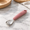 Cubkins 304 stainless steel toddler fork with raspberry silicone handle on a marble counter