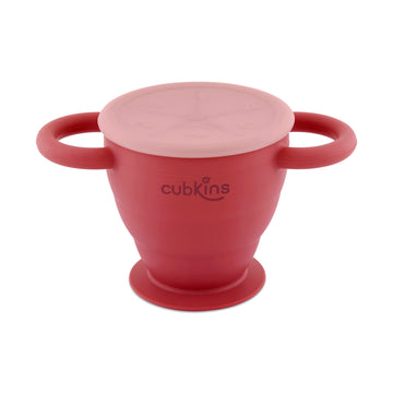 Cubkins cherry red collapsible silicone snack cup with two handles, a suction base, and a dust-free lid.