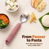 Cubkins raspberry 304 steel toddler fork with a paneer cube on the tines, surrounded by paneer, idli on banana leaf, carrots, broccoli, pasta and fruit