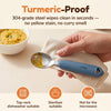 Cubkins 304 steel baby spoon head being wiped clean of turmeric dal, blue olive silicone handle, with care icons for dishwasher, steriliser and no microwave