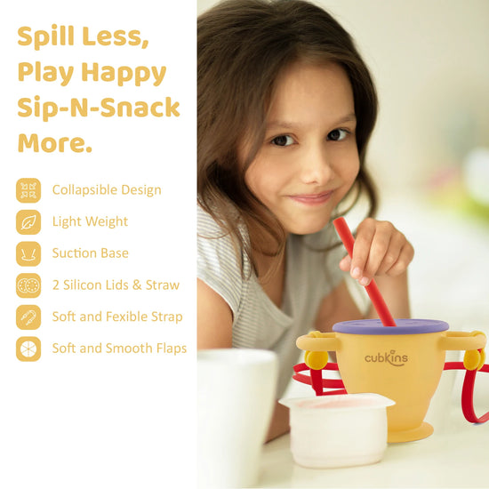 Young girl using the Cubkins Sip-N-Snack cup with its suction base and soft straw for a mess-free healthy snack time