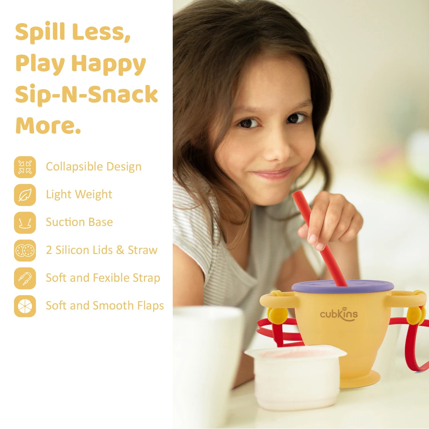 Young girl using the Cubkins Sip-N-Snack cup with its suction base and soft straw for a mess-free healthy snack time
