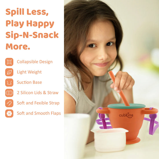 Young girl using the Cubkins Sip-N-Snack cup with its suction base and soft straw for a mess-free healthy snack time