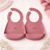 Set of 2 Cubkins silicone baby bibs in Raspberry pink color with secure-lock closure system
