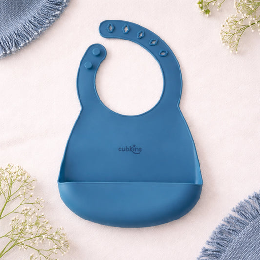 Cubkins silicone baby bib in Blue Olive color with adjustable snap closure and deep food-catching pocket, displayed flat on neutral background