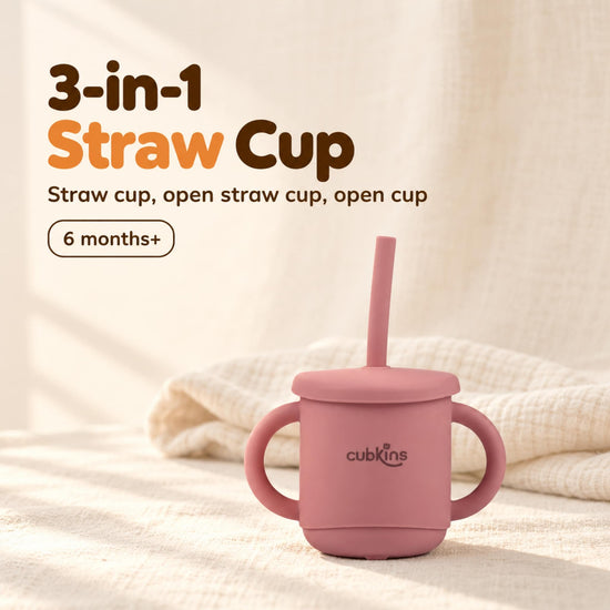 Cubkins 3-in-1 silicone straw cup in Raspberry with lid and straw, two handles and the cubkins wordmark, for 6 months+