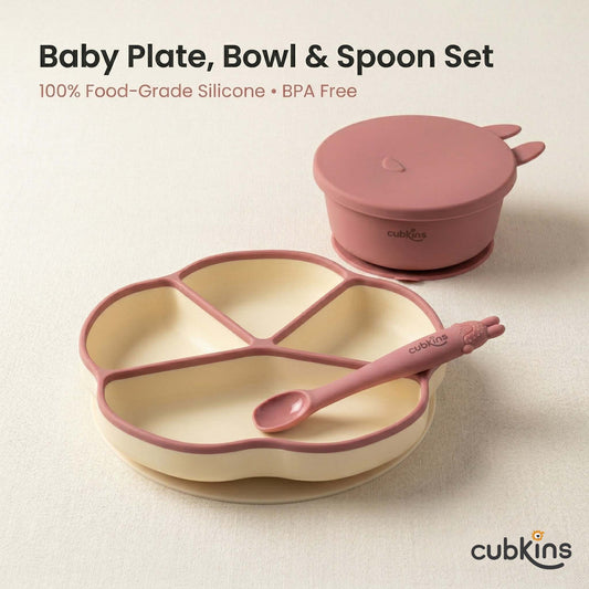 Cubkins 3-piece silicone baby feeding set in Raspberry — 4-compartment suction thali plate, suction bowl with bunny-ear lid, and bendable spoon on a neutral background