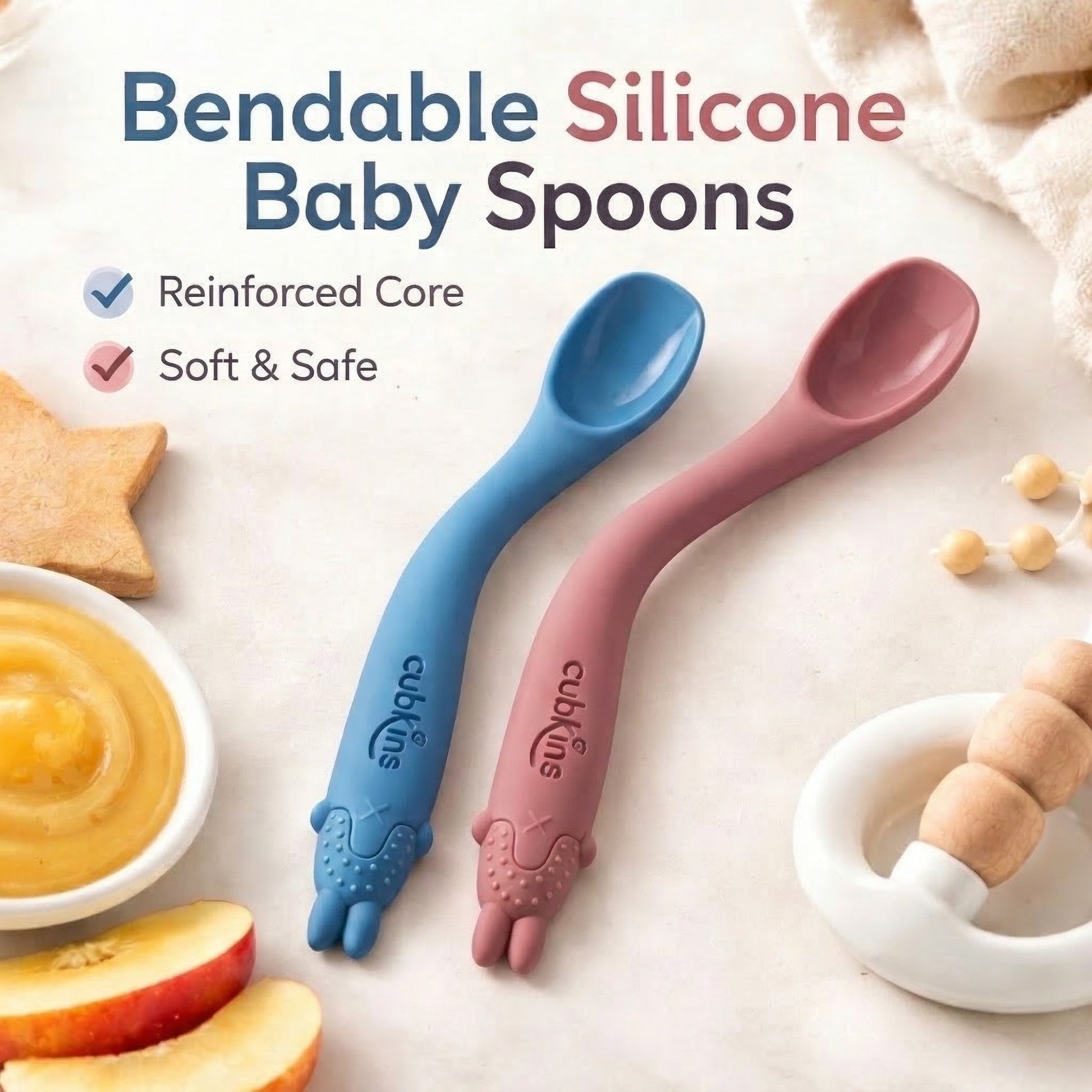 Cubkins bendable silicone baby spoons set of 2 in blue and raspberry with reinforced core and animal-shaped teether handle, shown with fruit and food puree