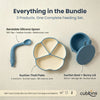 Flat lay of Cubkins Blue Olive 3-piece feeding bundle showing labelled components: bendable silicone spoon with 180° flex, 4-compartment suction thali plate, and suction bowl with bunny-ear storage lid