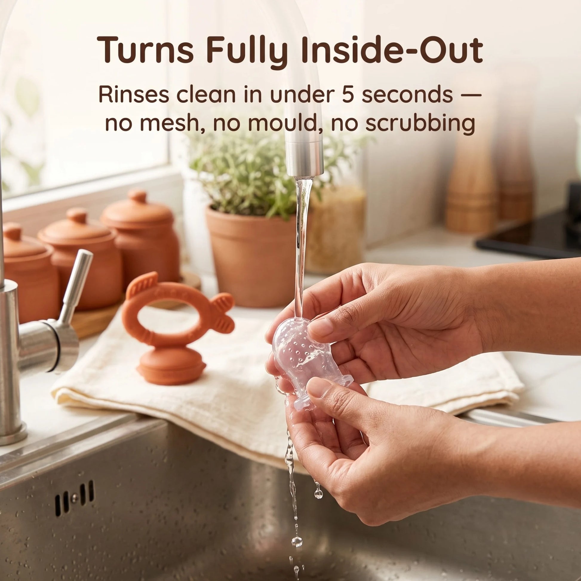 Cubkins silicone feeder sac turned fully inside-out rinsing clean under tap water in seconds – hygienic alternative to mesh feeders
