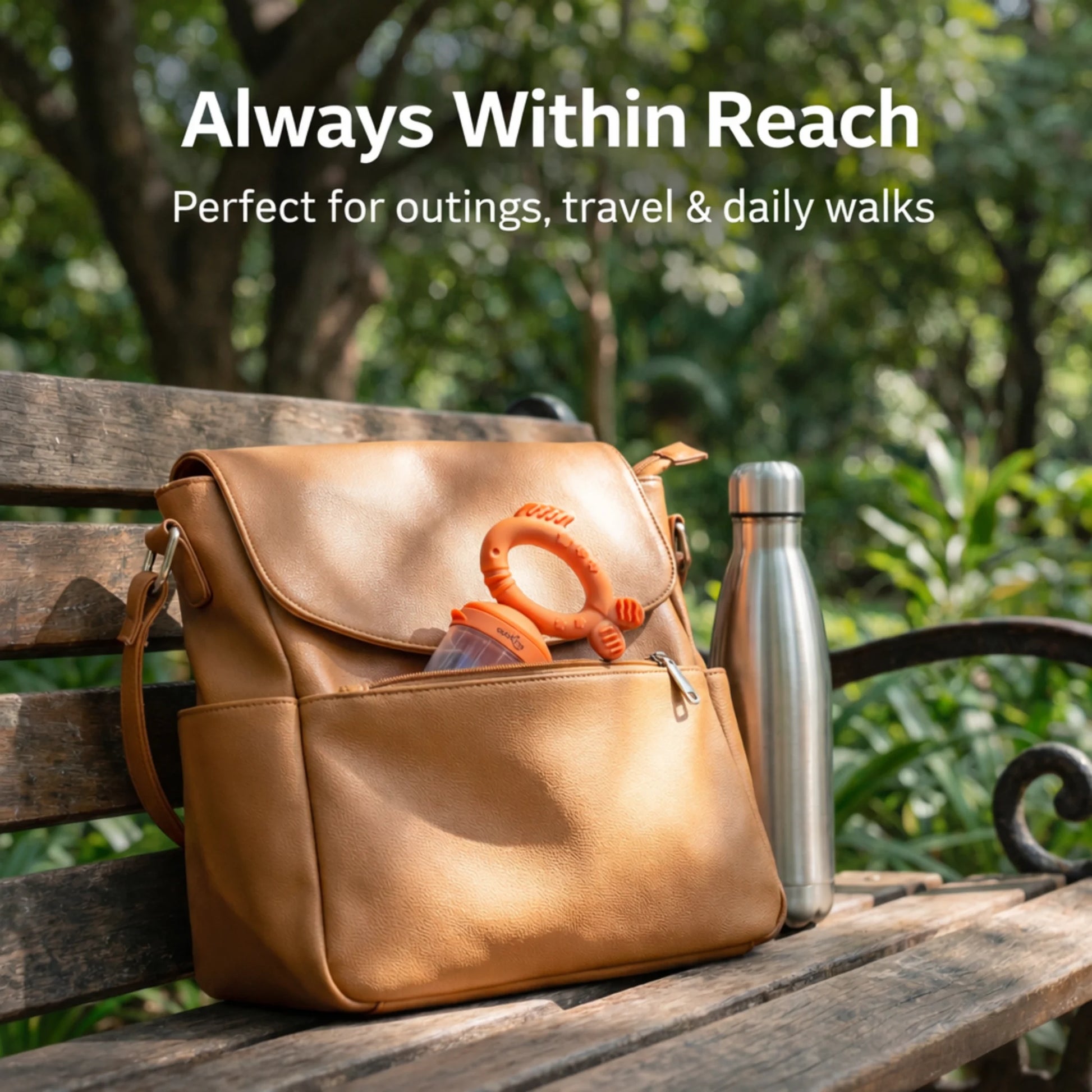 Cubkins silicone baby fruit feeder with protective dust-proof cap tucked into a diaper bag pocket at a park – travel-ready and compact