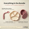 Flat lay of Cubkins Raspberry 3-piece feeding bundle showing labelled components: bendable silicone spoon with 180° flex, 4-compartment suction thali plate, and suction bowl with bunny-ear storage lid