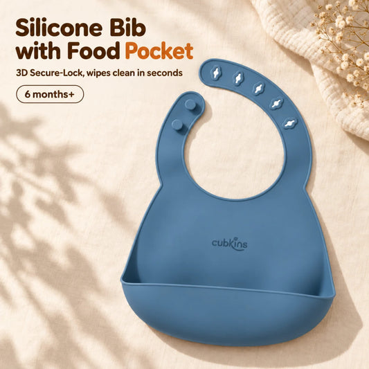 Cubkins blue olive silicone baby bib with five raised 3D buttonholes, two studs and a deep stay-open pocket, on cream linen, for 6 months+