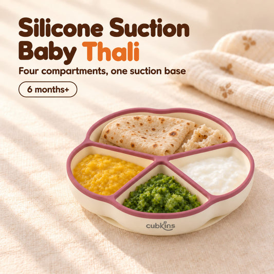 Cubkins silicone suction plate with a raspberry rim, a baby thali of roti, dal, sabzi and curd in its four compartments, for 6 months+