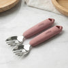 Two Cubkins raspberry silicone-handle stainless steel baby forks on marble surface — soft grip handle safe for toddler self-feeding