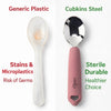 Side-by-side comparison of Cubkins stainless steel pink baby spoon and a yellowed, stained plastic baby spoon