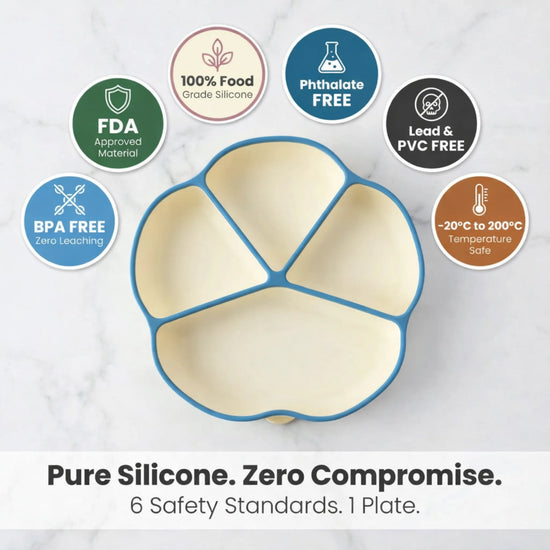 Empty blue Cubkins suction plate on marble surface surrounded by safety badges: FDA approved, 100% food-grade silicone, phthalate free, lead and PVC free, BPA free, -20°C to 200°C temperature safe