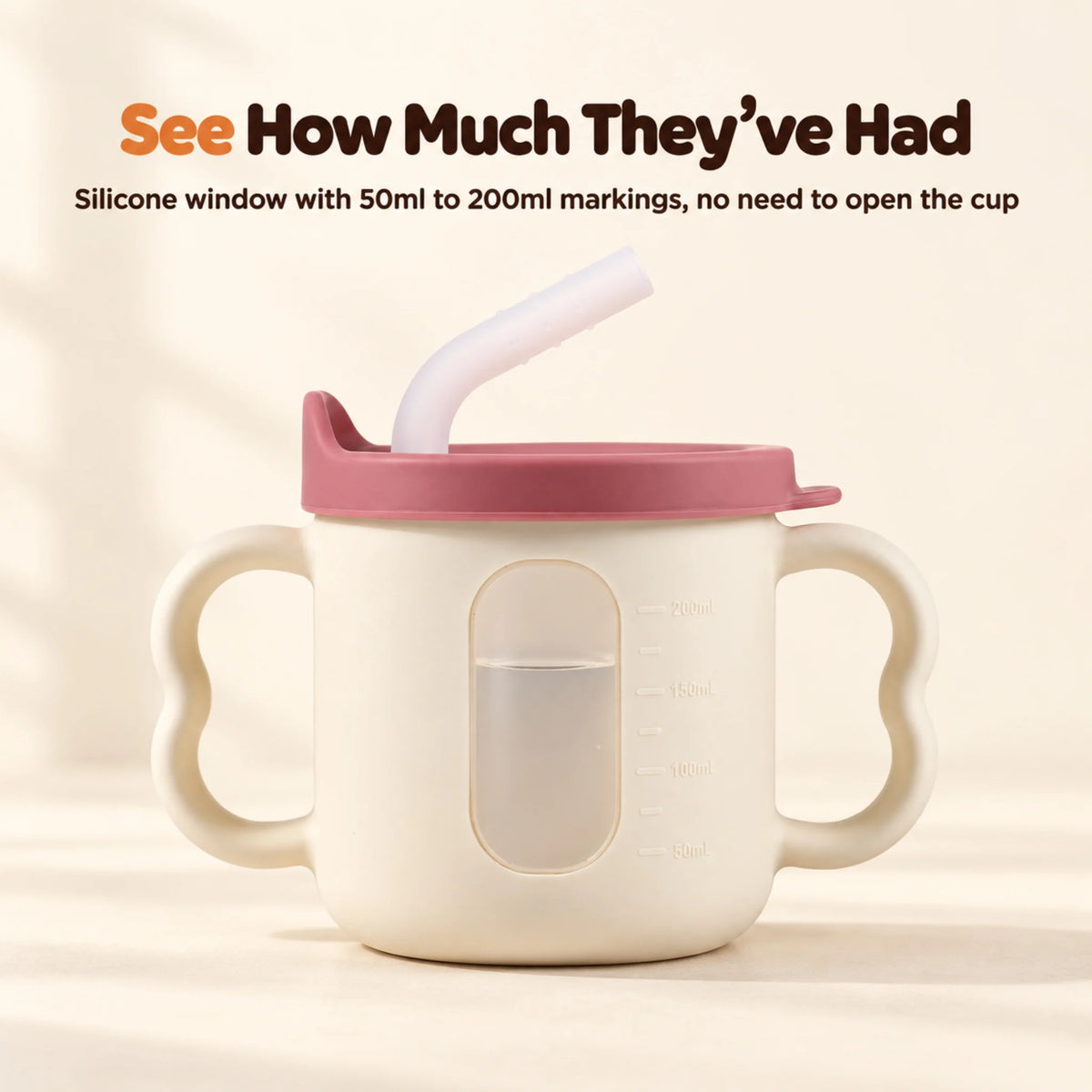 Window side of the Cubkins raspberry straw training cup showing water through the frosted silicone window with 50ml to 200ml markings