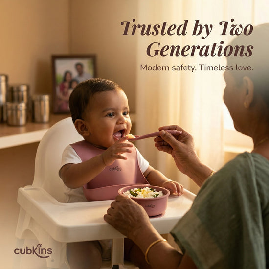 Indian grandmother feeding baby curd rice using Cubkins raspberry silicone spoon and suction bowl — trusted by two generations