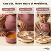 Three-panel infographic titled "One Set. Three Years of Mealtimes." showing Cubkins raspberry feeding set across developmental stages: Stage 1 (6M+) First Tastes — parent spoon-feeding baby from a suction bowl; Stage 2 (12M+) Self-Feeding — toddler using the divided plate and cutlery; Stage 3 (24M+) Independent Eating — child drinking from the straw sippy cup.