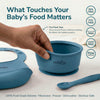 Pinch test demonstrating Cubkins blue silicone bowl is BPA free, PVC free, phthalate free and FDA approved — 100% food-grade silicone