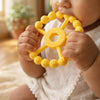 Baby gripping and chewing Cubkins Silicone Ring Teether in Lemon yellow – easy to hold for small hands, food-grade silicone, safe for 3 months and above