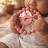 Baby gripping and chewing Cubkins Silicone Ring Teether in Raspberry pink – easy to hold for small hands, food-grade silicone, safe for 3 months and above