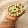Cubkins Ring Teether in Lime held in an adult palm showing 10cm diameter – perfect grip size for babies, easy to hold and impossible to swallow